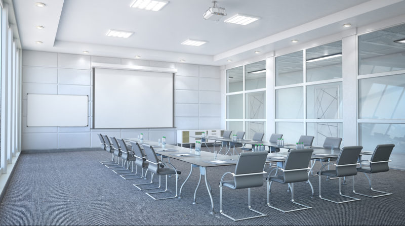 conference room with chairs in U shape seating and projector